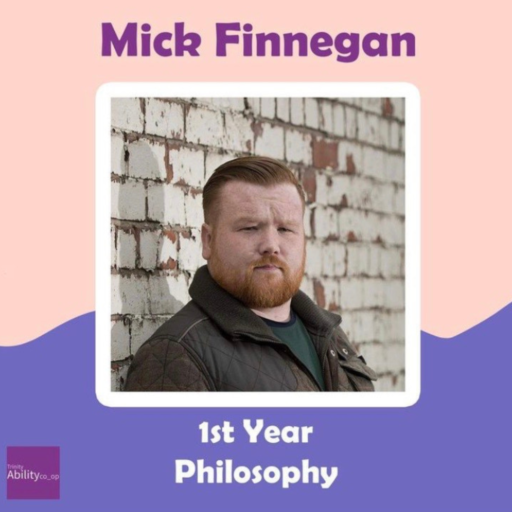 Mick Finnegan, a first year Philosophy student. A white man with short red hair and a beard.
